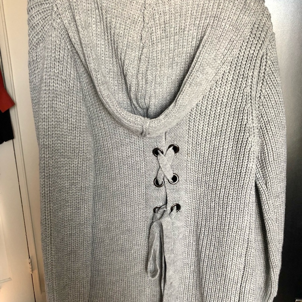 Light grey hooded longline sweater with cute back detailing.